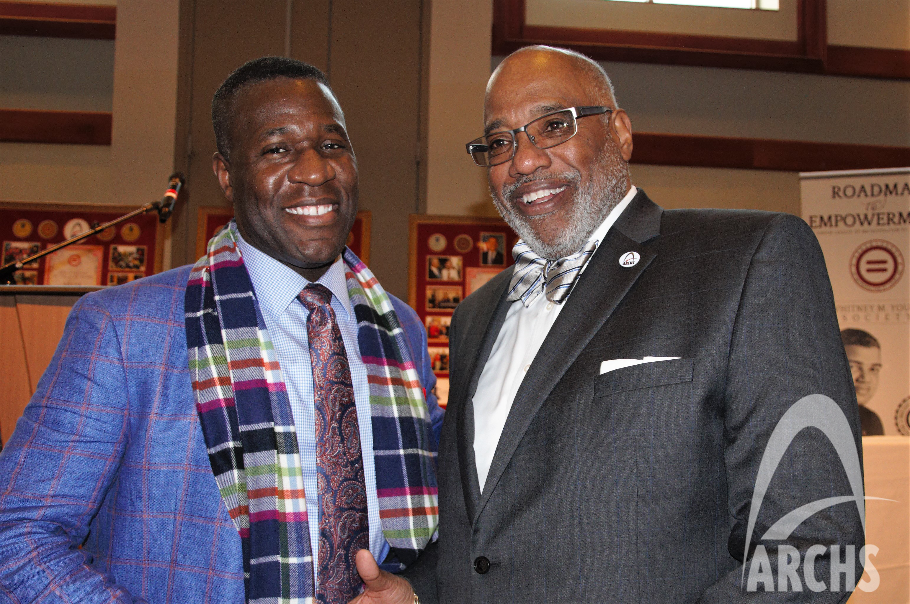 Wendell Kimbrough shaking hands with Dr. Art McCoy